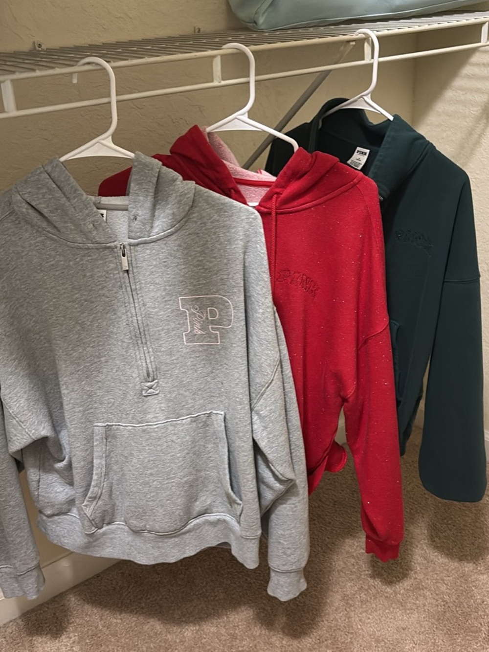 Three Victoria’s Secret pink sweatshirts, size medium